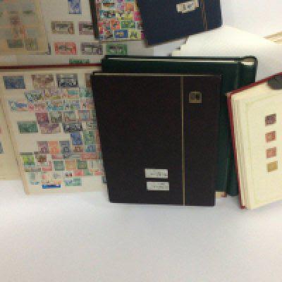 A collection of stamps in albums and on sheets a good selection of predominantly unused George VI Empire Commonwealth and colonial stamps also a conforming collection of Elizabeth II pre-decimal stamps and some Victorian used stamps.