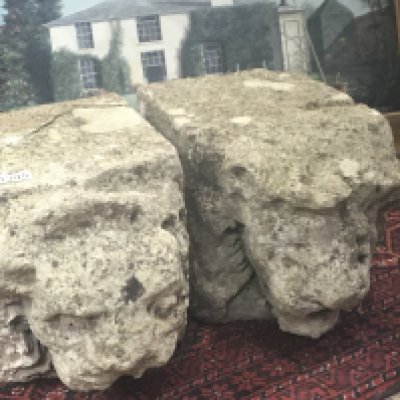 Two carved stone Ancient architectural Gargoyles the raised masks protruding from stone blocks.37x23 cm (2)