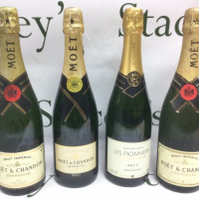 Four bottles of champagne comprising three Moet & Chandon examples plus one other. Shipping category D.