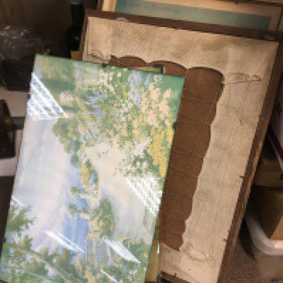 A collection of pictures including framed tapestry art of a rural town, vintage ministry of health print etc