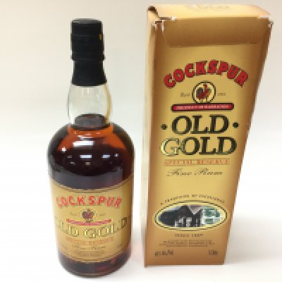 Bottle of cockspur old gold rum. 1 litre seal bottle with box.