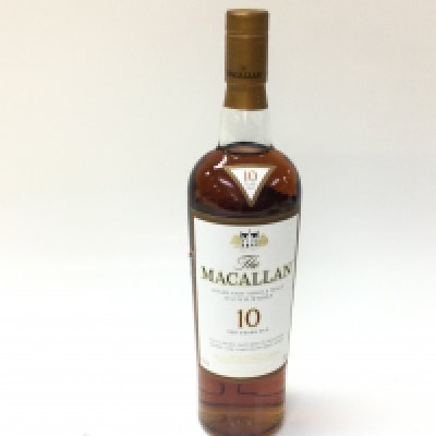 A bottle of MacAllan 10 years single malt whisky. 700ml and sealed.