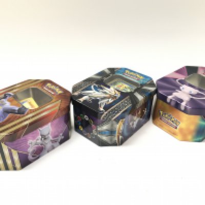 A collection of modern Pokemon cards with tins , postage cat b