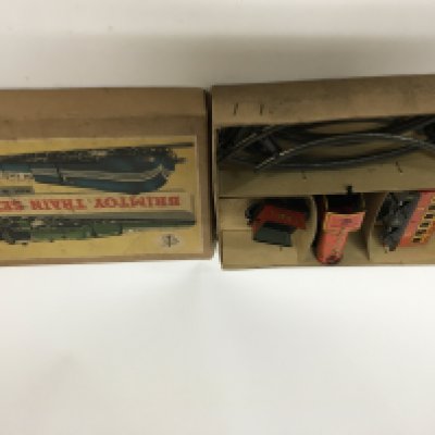 A Vintage boxed Brimtoy tin plate clockwork train set in a fitted box. Very good condition.