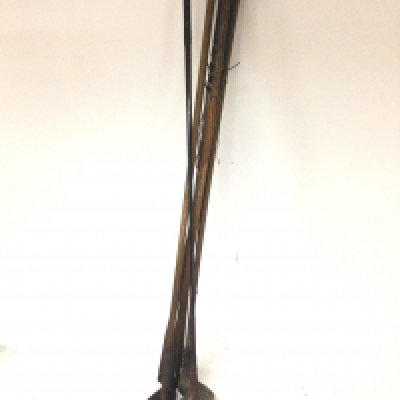 A collection of vintage golf clubs hickory sticks.