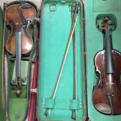 Two cased vintage violins including a stradivarius Copy, both violins in need of restoration. Postage category C