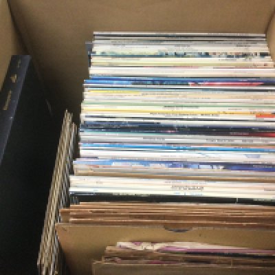 A box of records comprising LPs, 78s and 7" singles by various artists including Elvis Presley, Elton John, Abba and many more.