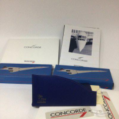 A collection of Concorde flight memorabilia menus models luggage labels etc.