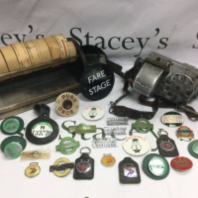 A bus conductor's ticket machine, enamel badges, rolls of vintage tickets etc. Shipping category C.