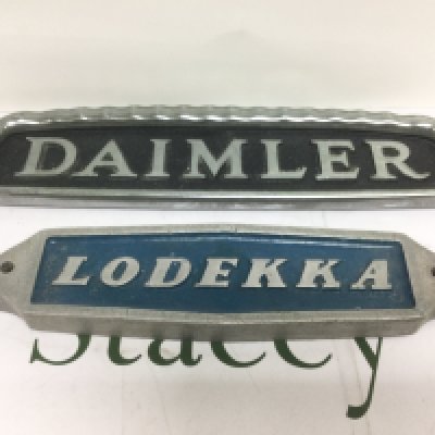 Two vintage metal bus signs comprising Daimler and Lodekka. Shipping category D.