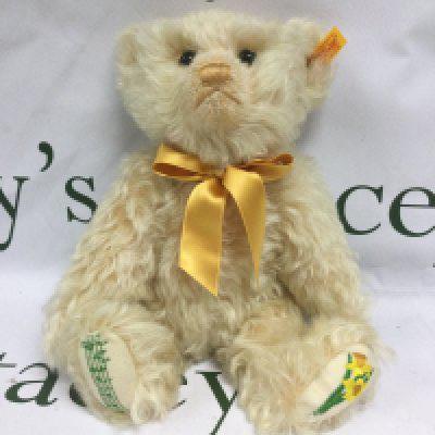 A boxed Steiff bear, daffodil and music and notation detail on feet, approx 30cm. Shipping category B.