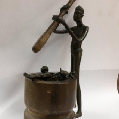 A collection of Ashanti figures together with a book and photo of the author A.W Cardinall