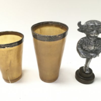 Two silver rimmed horn cups and a vintage Lincoln imp car mascot. Postage B
