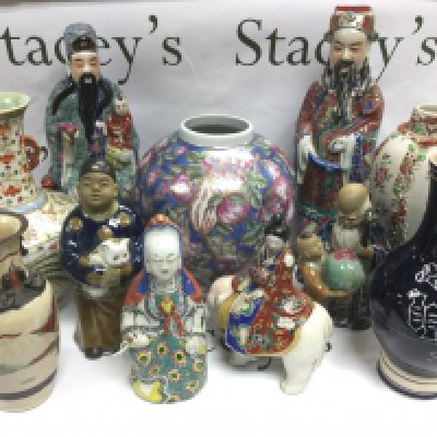 A box of Oriental ceramics comprising figures, vases etc. Shipping category D.