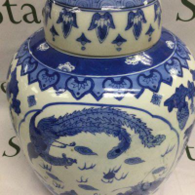 A reproduction blue and white Chinese vase and cover depicting a dragon and a bird with a flaming pearl, approx height 38cm. Shipping category D.