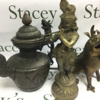 A large Oriental metal teapot, a brass dragon and a female Tibetan figure (3). Shipping category D.