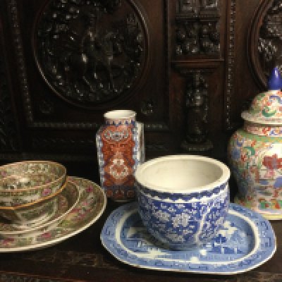 A collection of Oriental ceramics comprising famille rose dishes and bowls, a blue and white vase decorated with prunus blossom etc. Shipping category D.