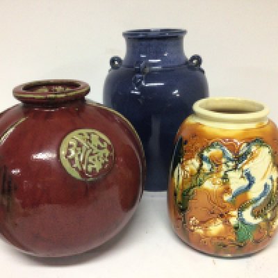 Three Chinese Export ceramic 20th century vases one with raised relief with dragons and caricature marks to the base Hight 18cm (3) no reserve