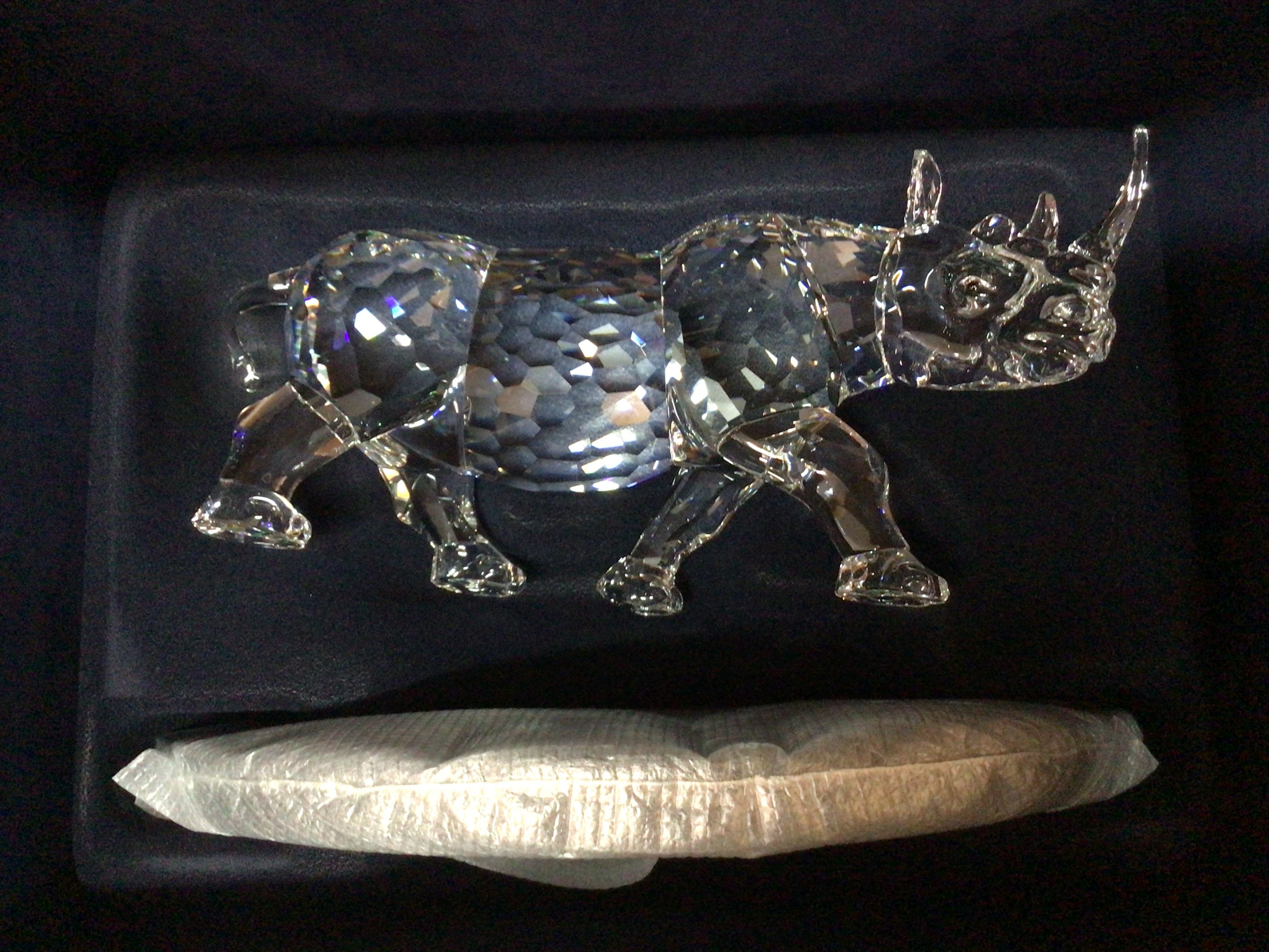 A very large limited edition Swarovski piece- The Rhinoceros 02238/10000 in large fitted box, fitted casing, with stand and framed certificate