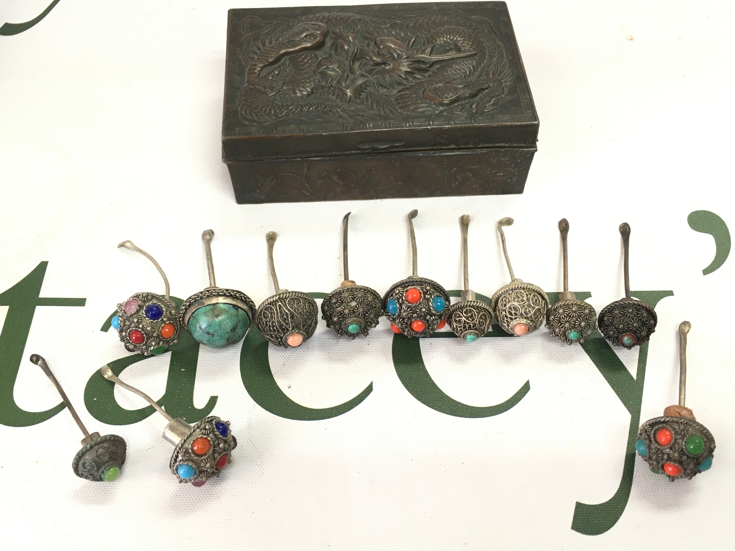 Ten Chinese snuff bottle tops in a Chinese dragon box . No reserve 