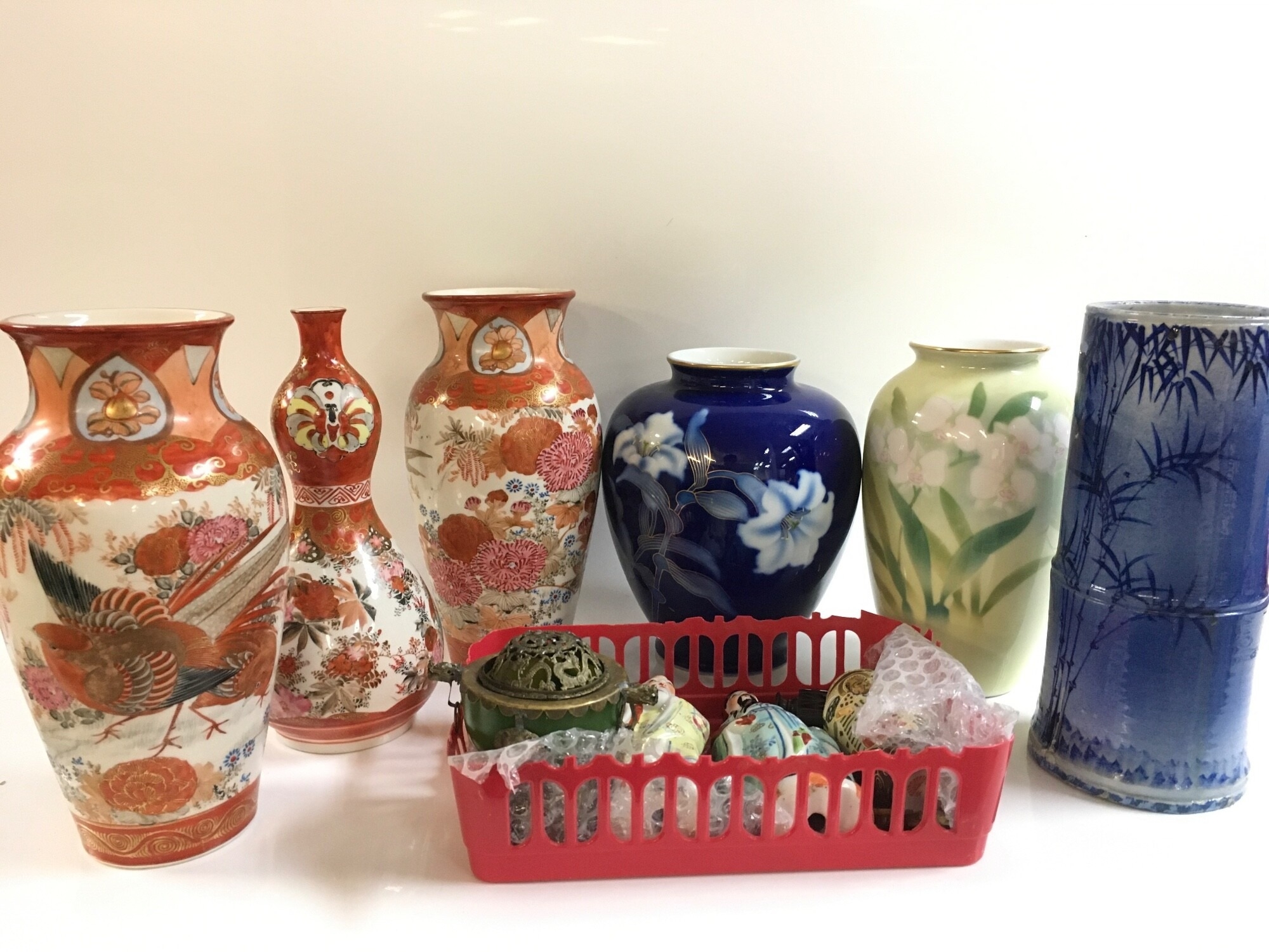Oriental ceramic items including six Chinese and Japanese vases, an incense burner with a green stone body (four character mark at base), metal dragon-head handles and pierced ornate design, small bronze vase, ceramic figures NO RESERVE