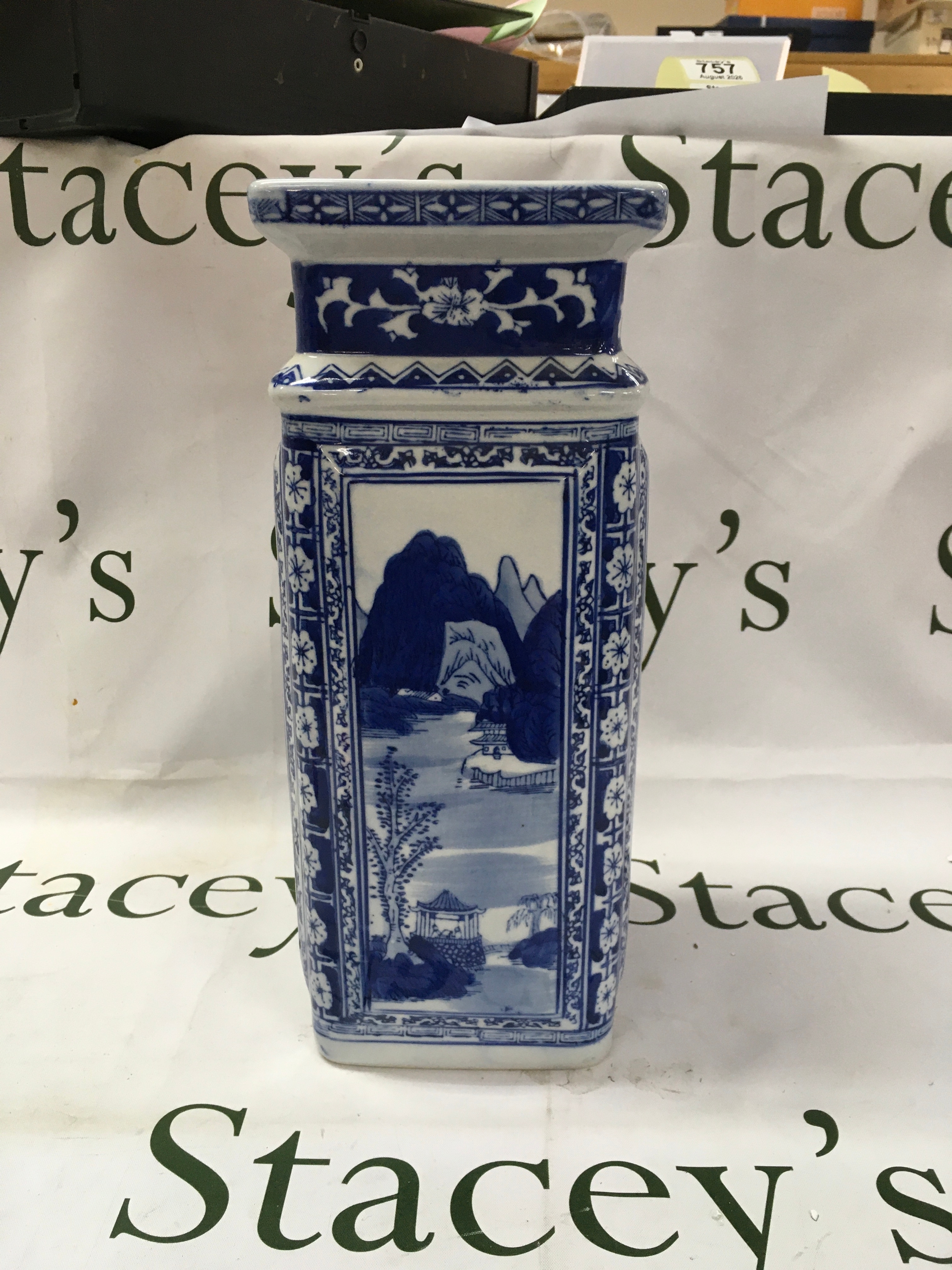 A chinese blue and white four sided porcelain vase. 