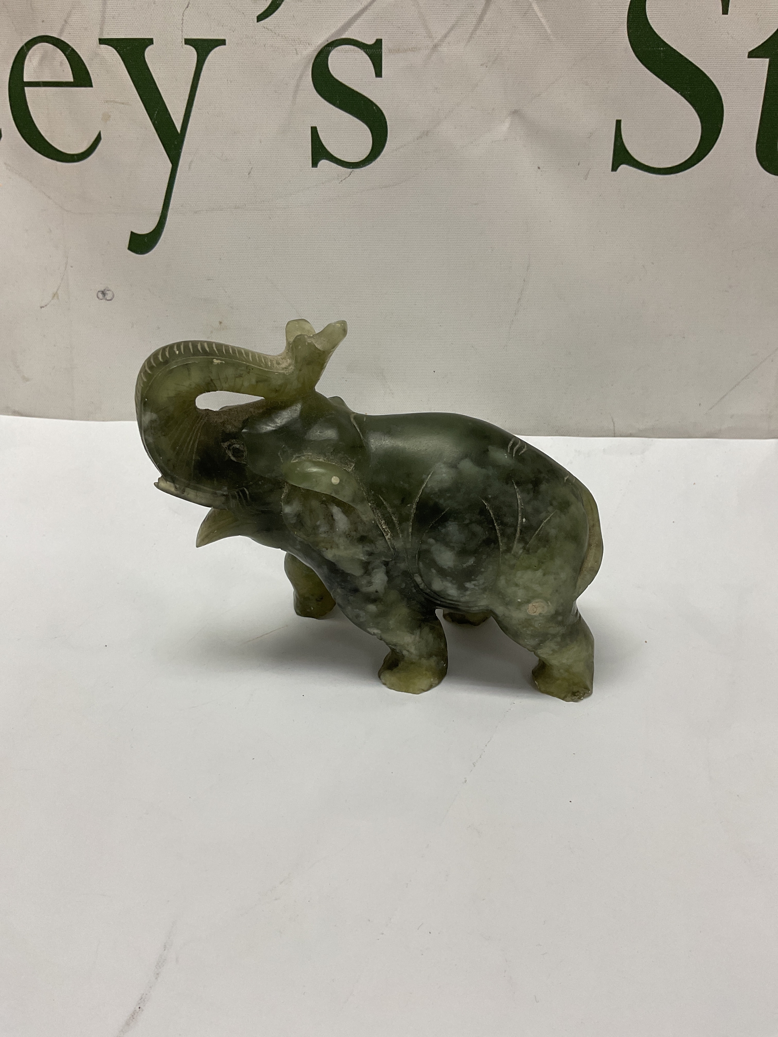 Carved Jade Elephant figure.H 11 cm x W 13 cm.
