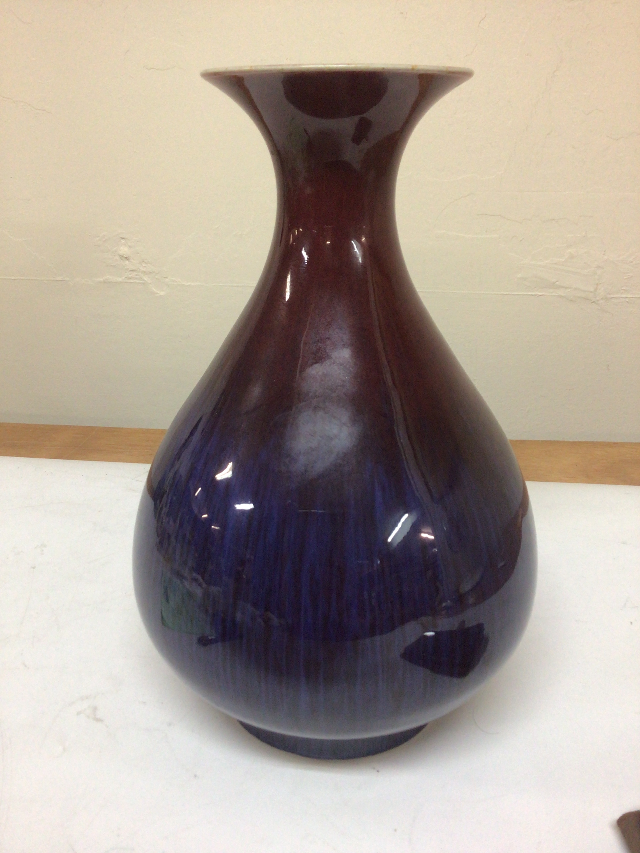 A Chinese Sang de Boeuf Vase of bulbous shape with a two tone glaze caricature marks to the base Republic very good condition no obvious damage hight 29cm  