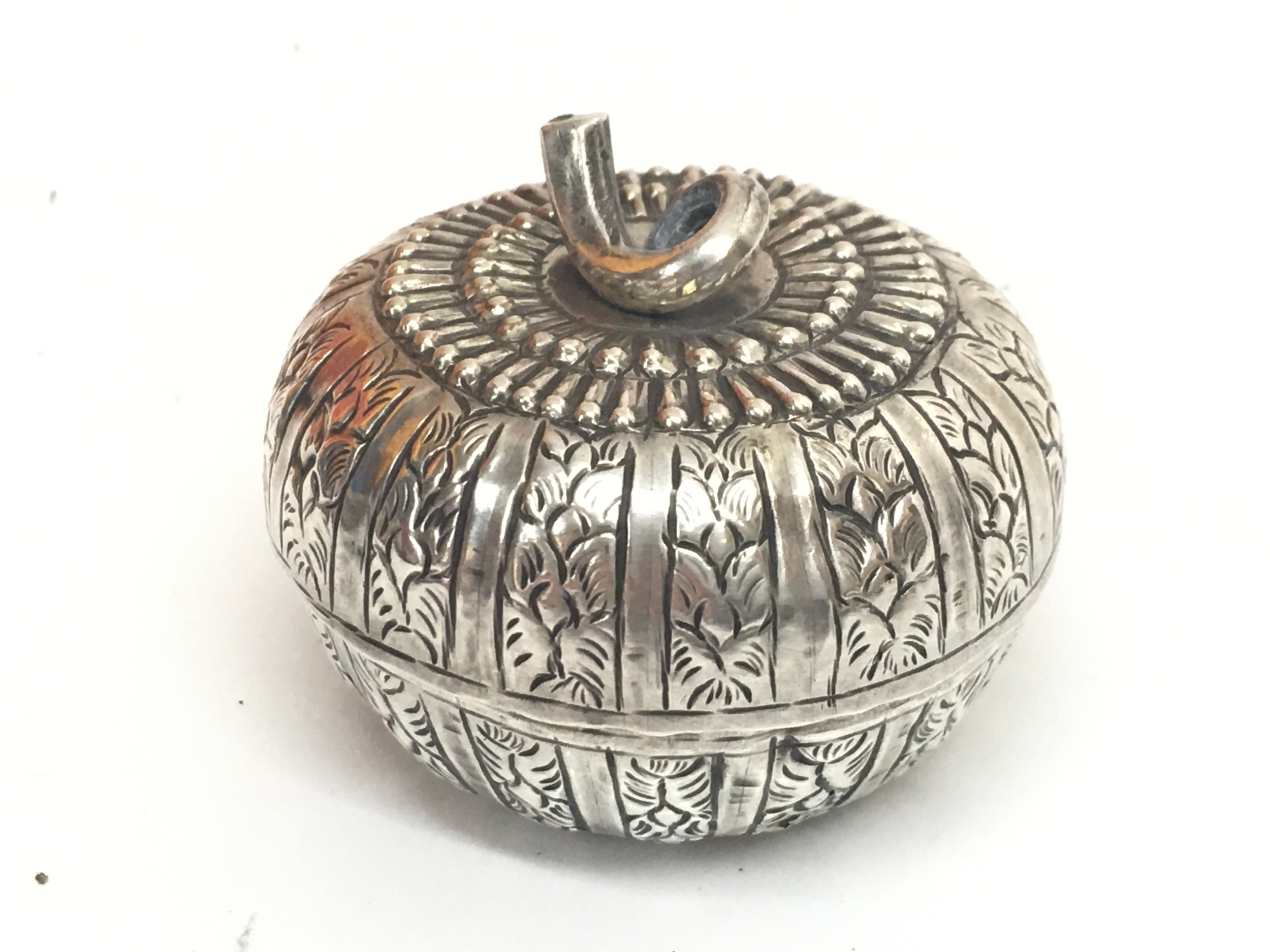 A 19th century Asian white metal lidded pot, 3cm tall