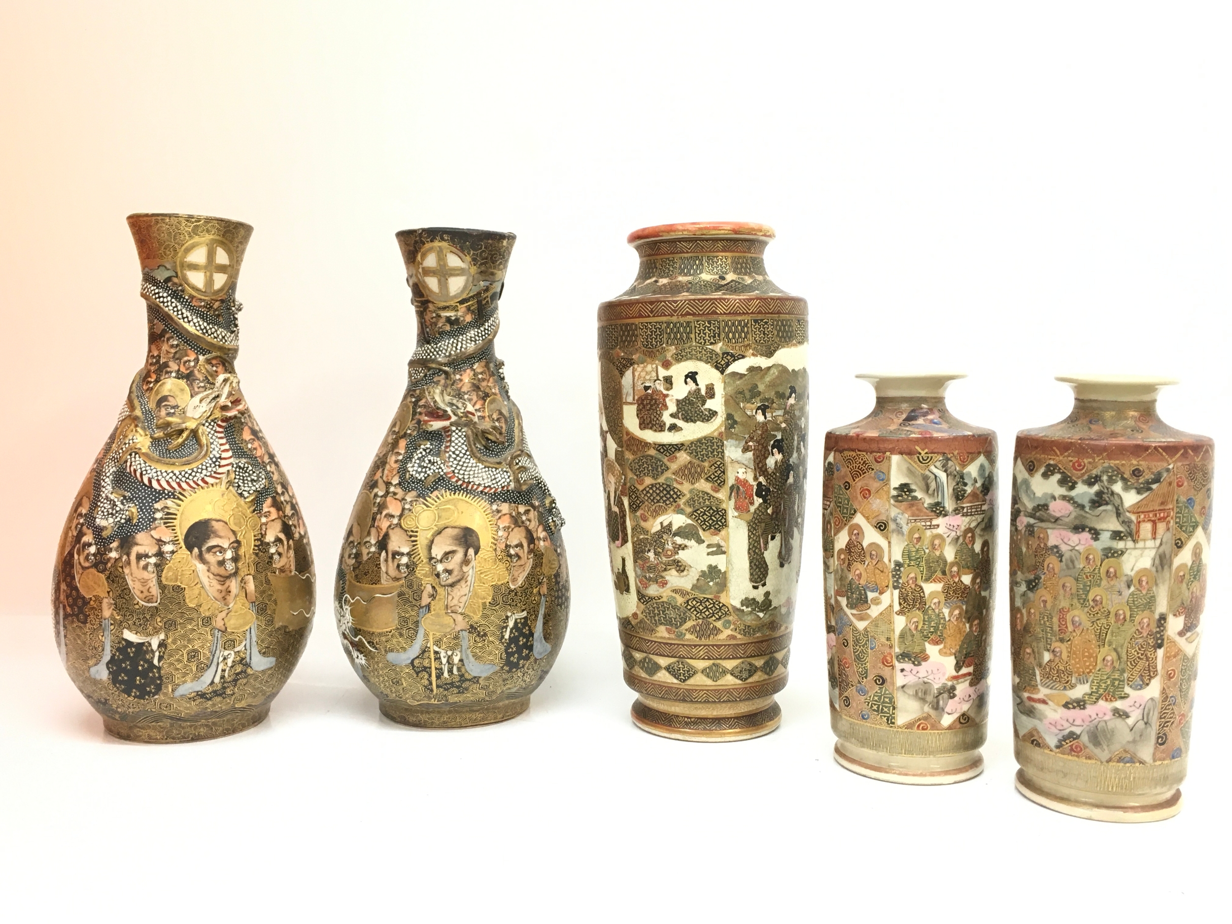 Five Japanese satsuma vases, 6 to 22cm tall.