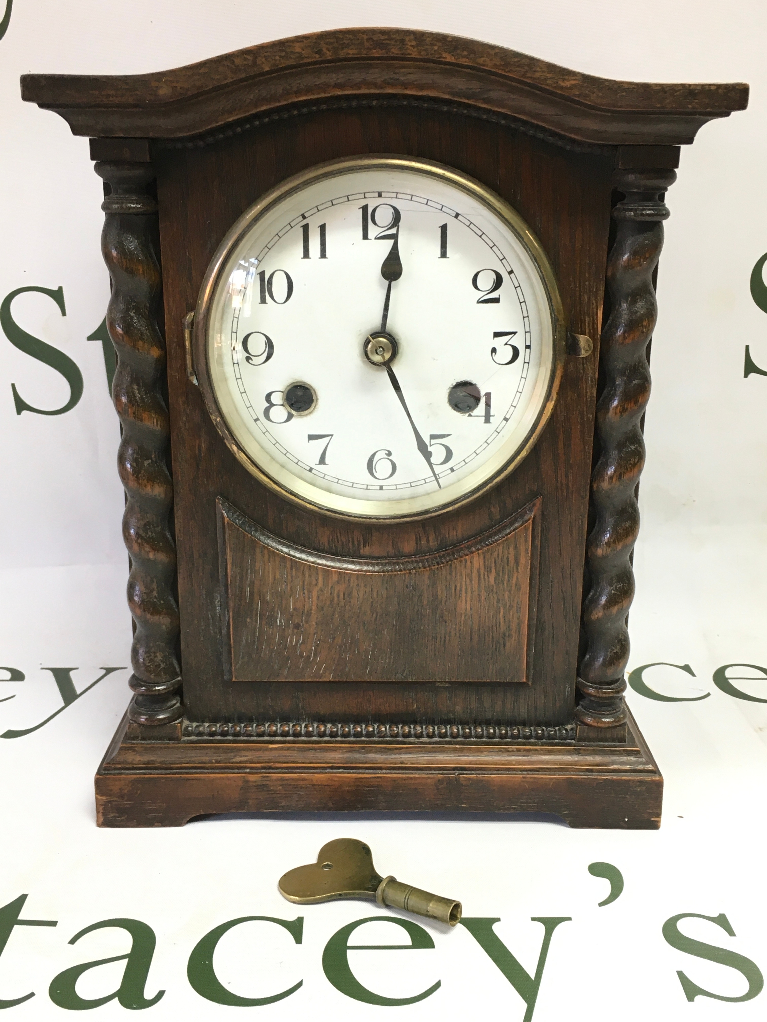 A 1920s Oak cased 8 day gong striking clock, marked Kienzle on the movement. With key . 21cm wide, 15cm long ,27cm tall