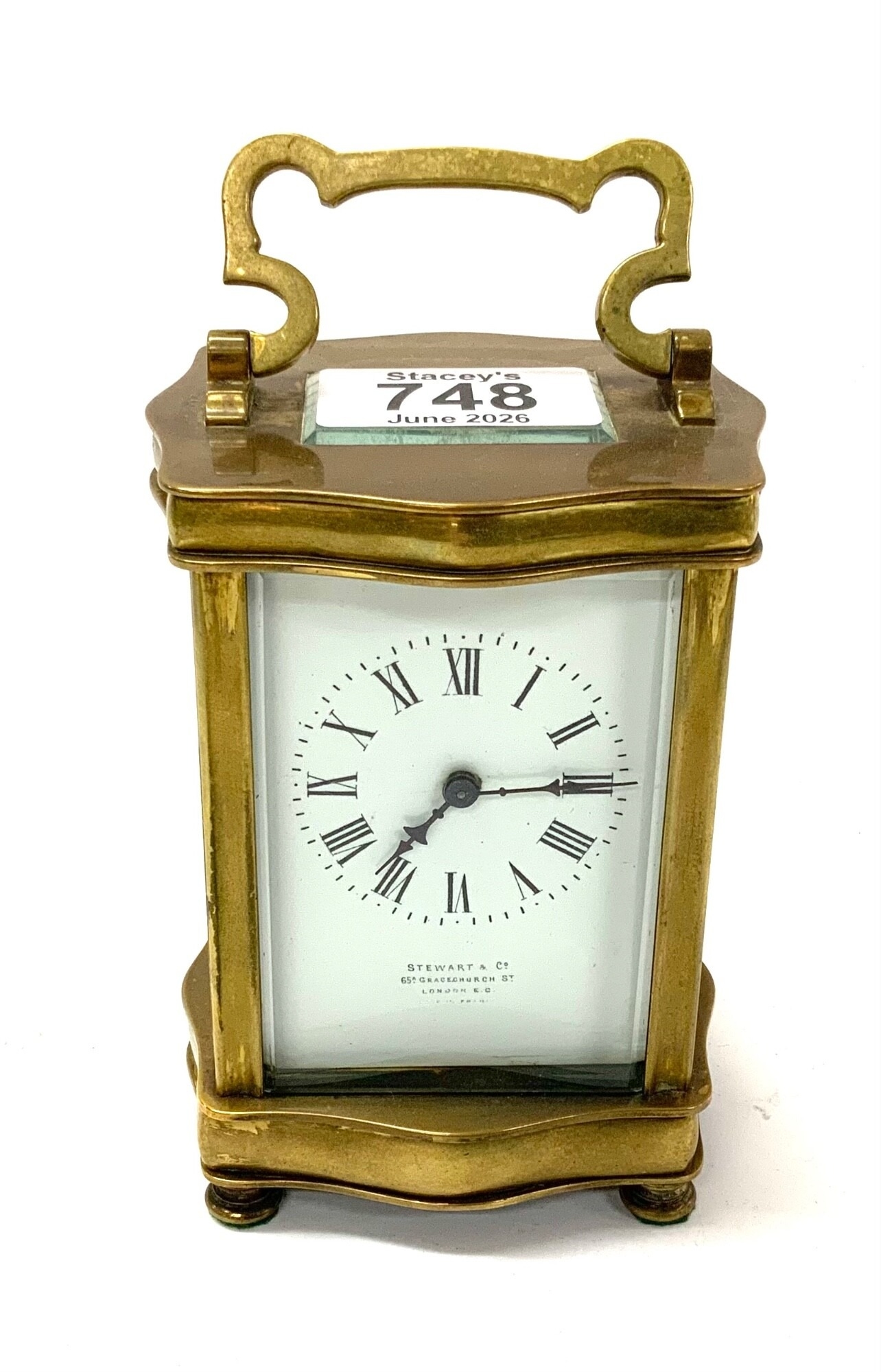 A Stewart & Co brass and glass bevelled 4 glass carriage clock. 12cm NO RESERVE