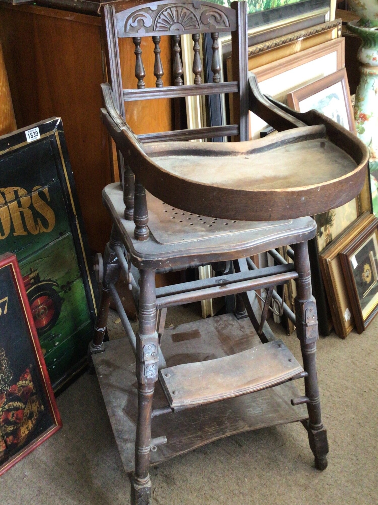 An Antique stained beechwood wood folding High chair with a carved back rail TO BE SOLD WITHOUT RESERVE