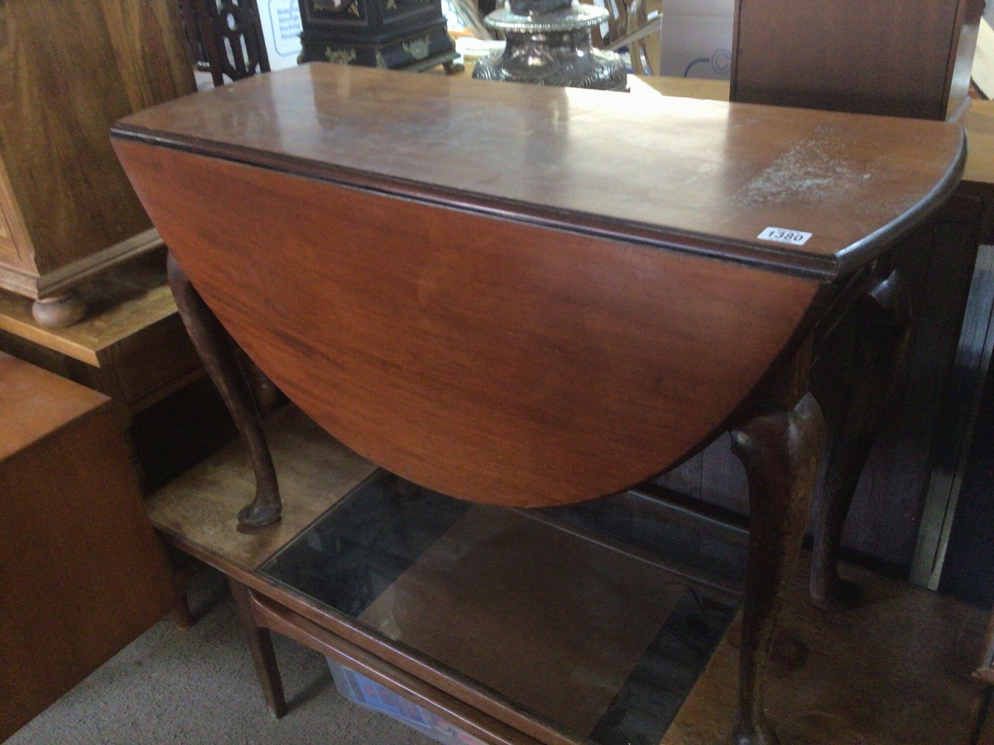 A late George III mahogany drop leaf table the twin flap top above a single drawer on cabriole legs. length 105cm TO BE SOLD WITHOUT RESERVE
