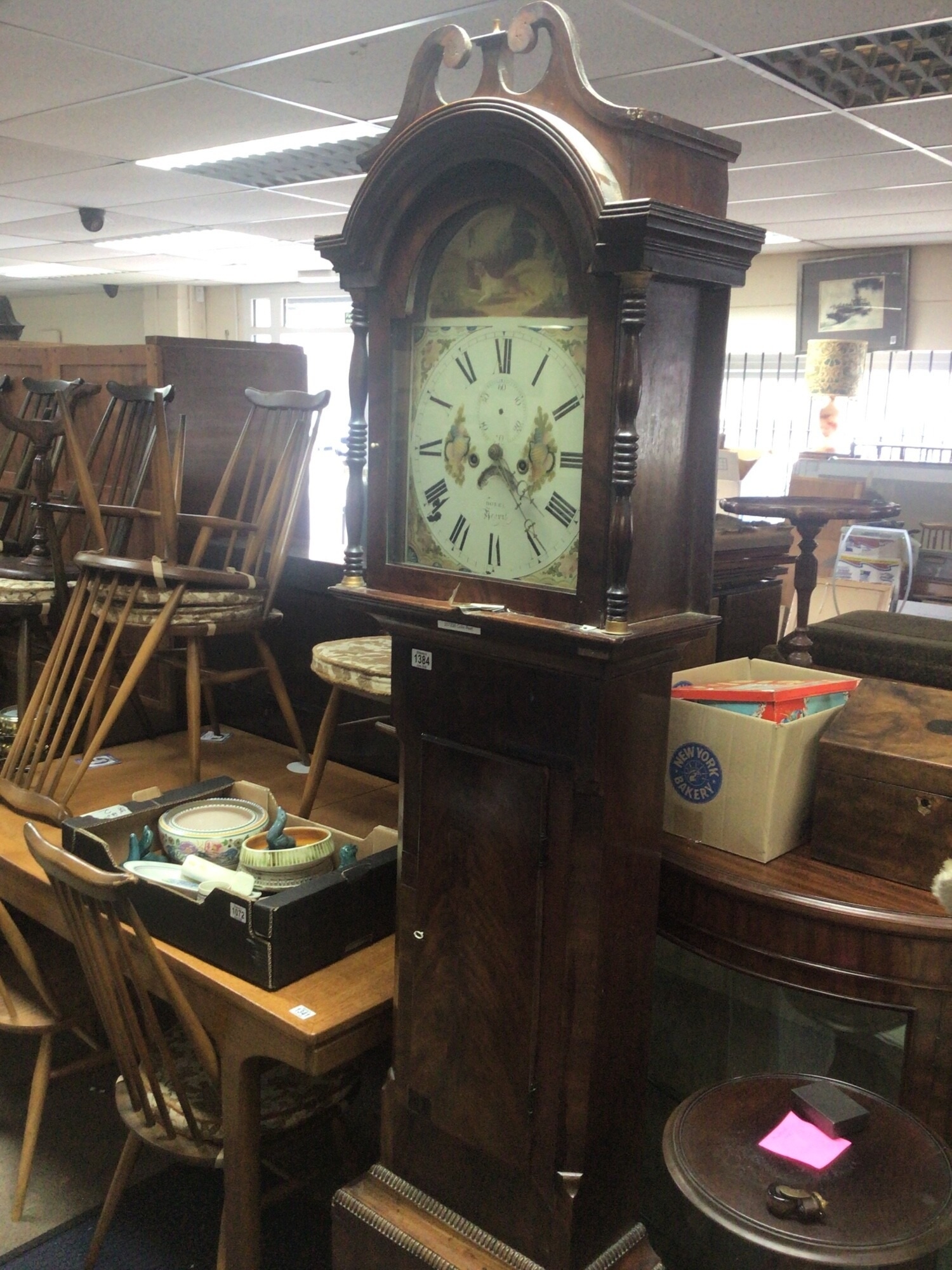 A 19th century Mahogany long case clock with an arched painted dial maker Dorel of Yeovil eight day going.