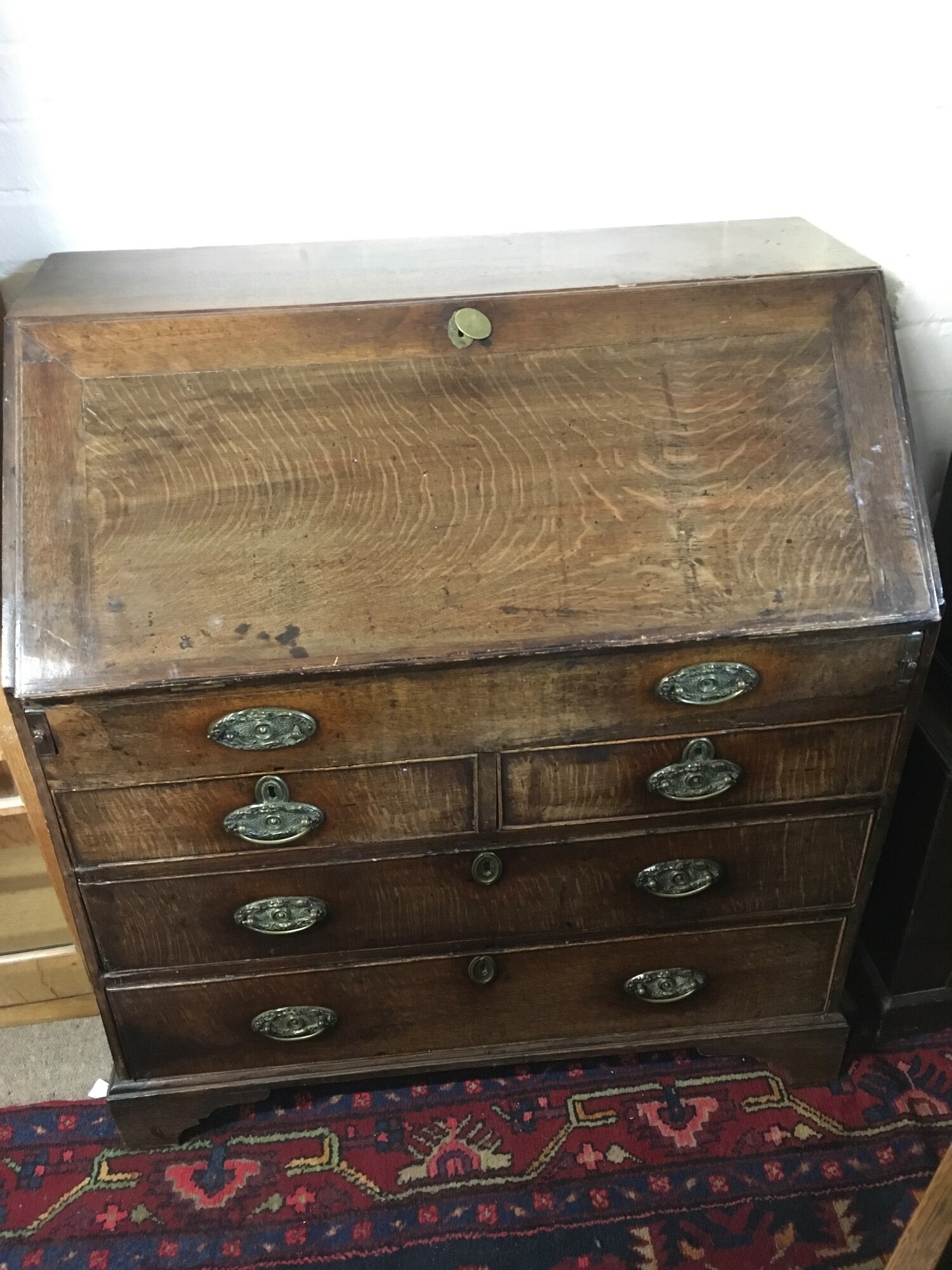 A George III oak bureau, approx 90cm x 100cm x 54cm.