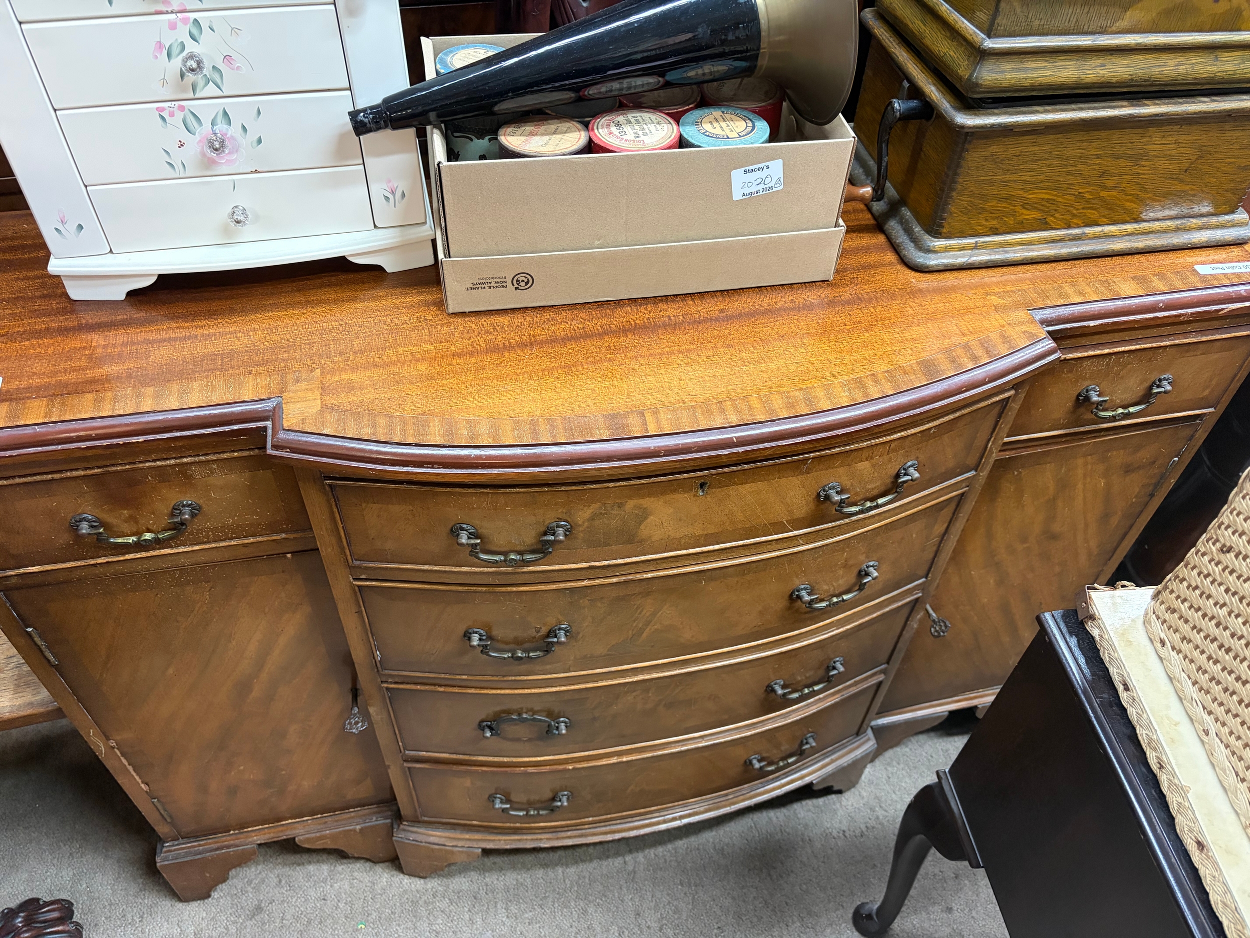 A bow fronted chest of drawers