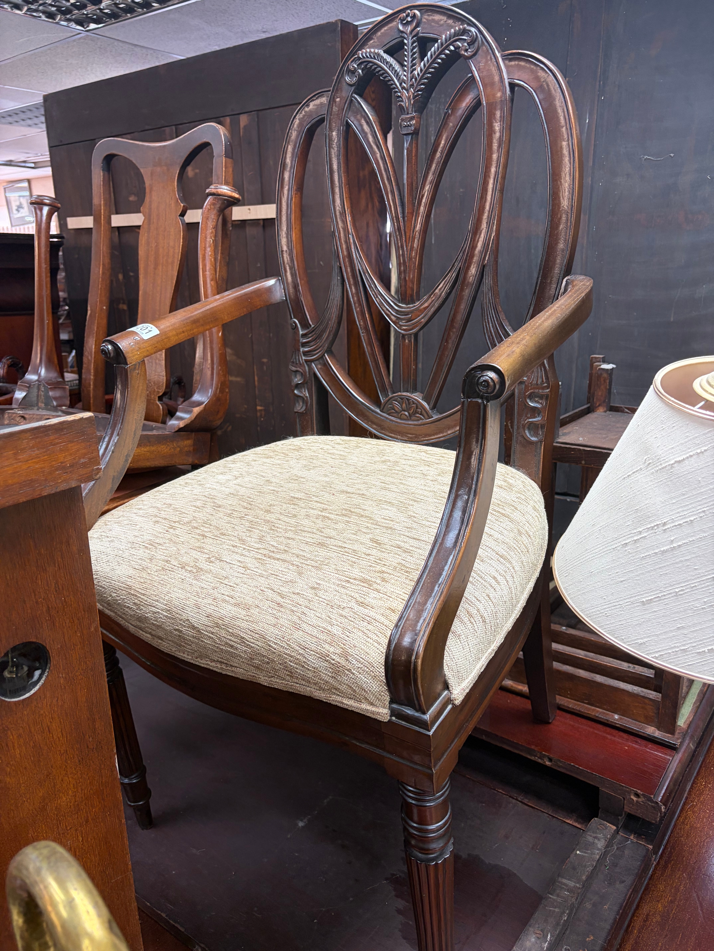 An Edwardian mahogany open armchair