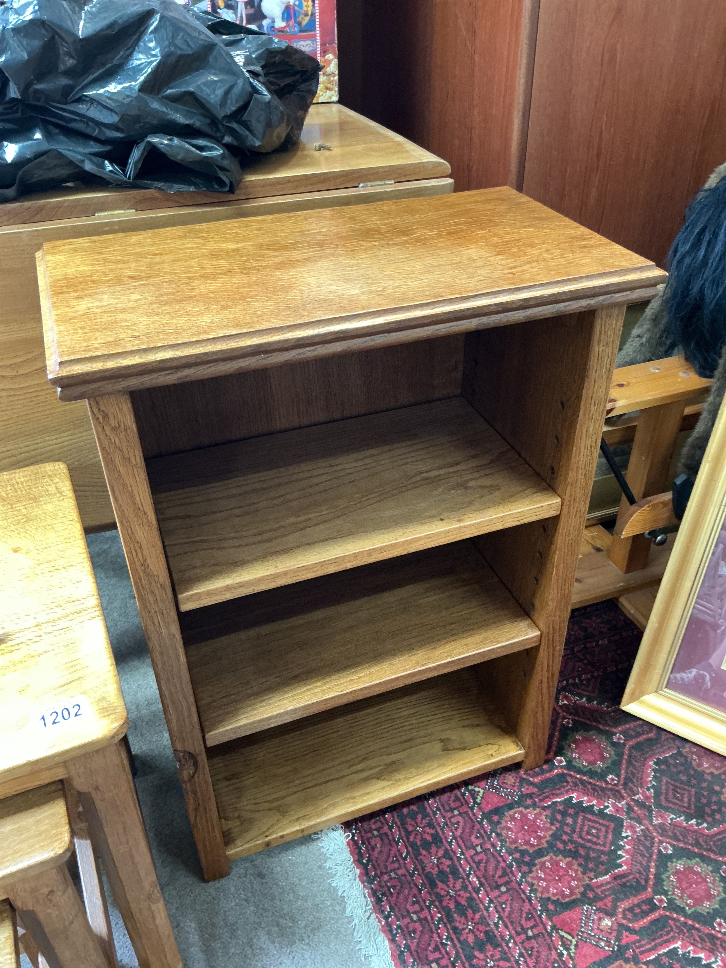 A Robert Mouseman Thompson two shelf bookcase circa 1960s, approx 50cm x 27cm x 69cm.