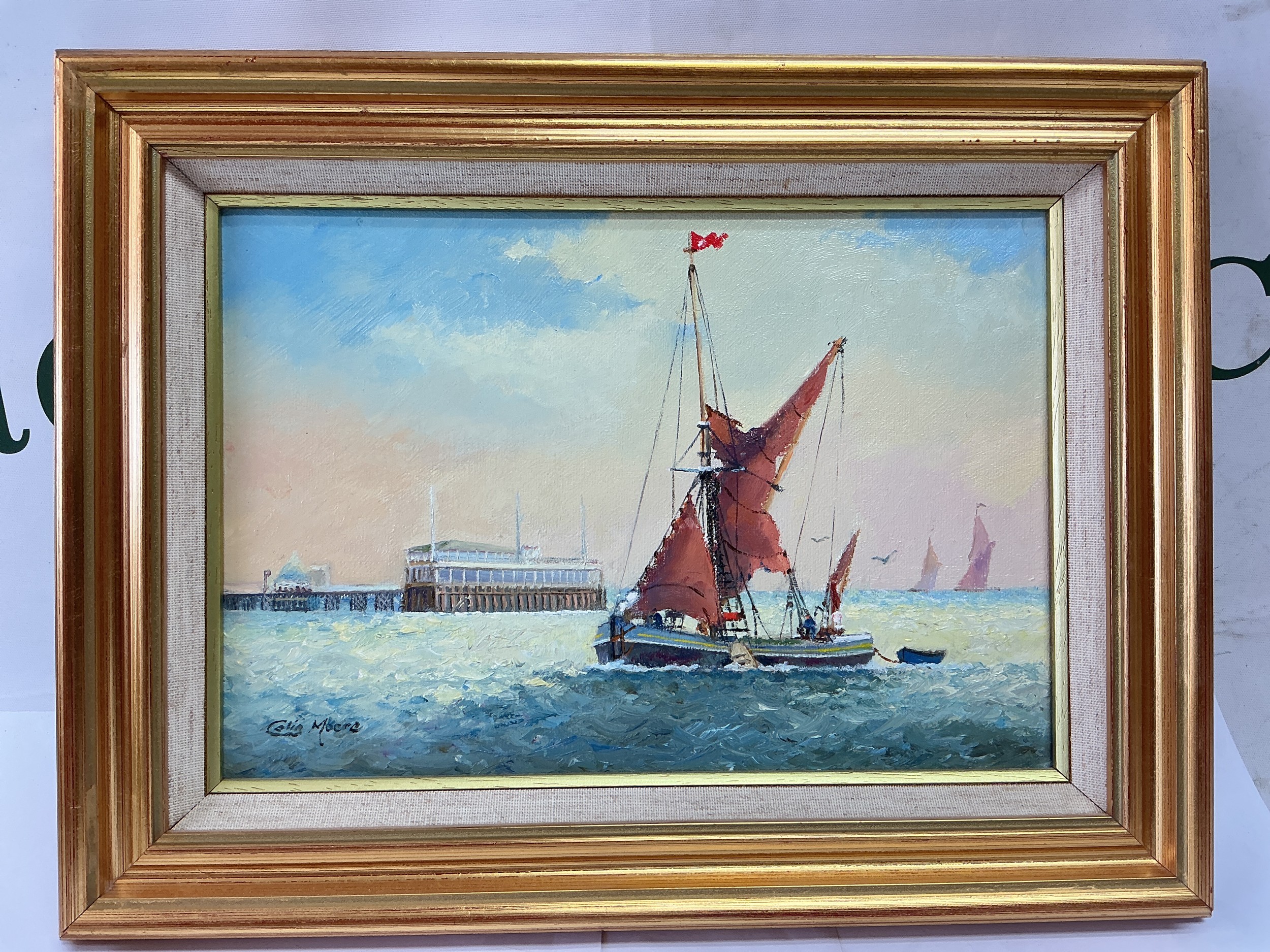 A small gilt framed oil on canvas of sailing boats by Colin Moore, approx 33cm x 25cm.