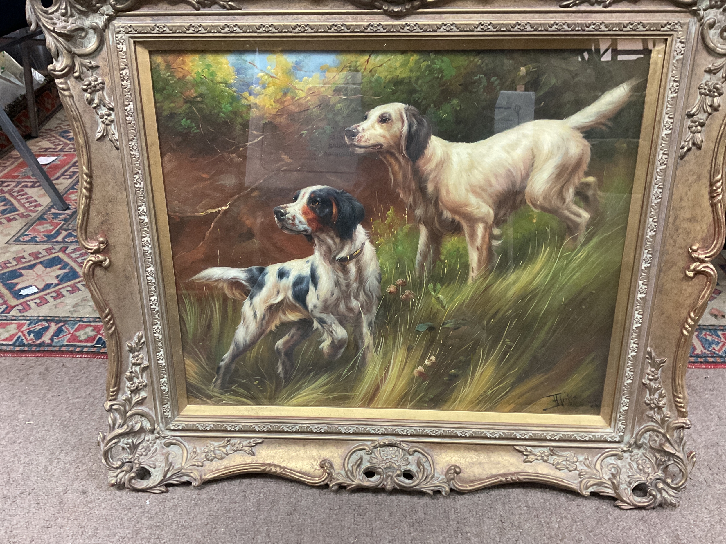 Oil on board of two Spaniels.in ornate gilded frame. 47 x 58 cm.