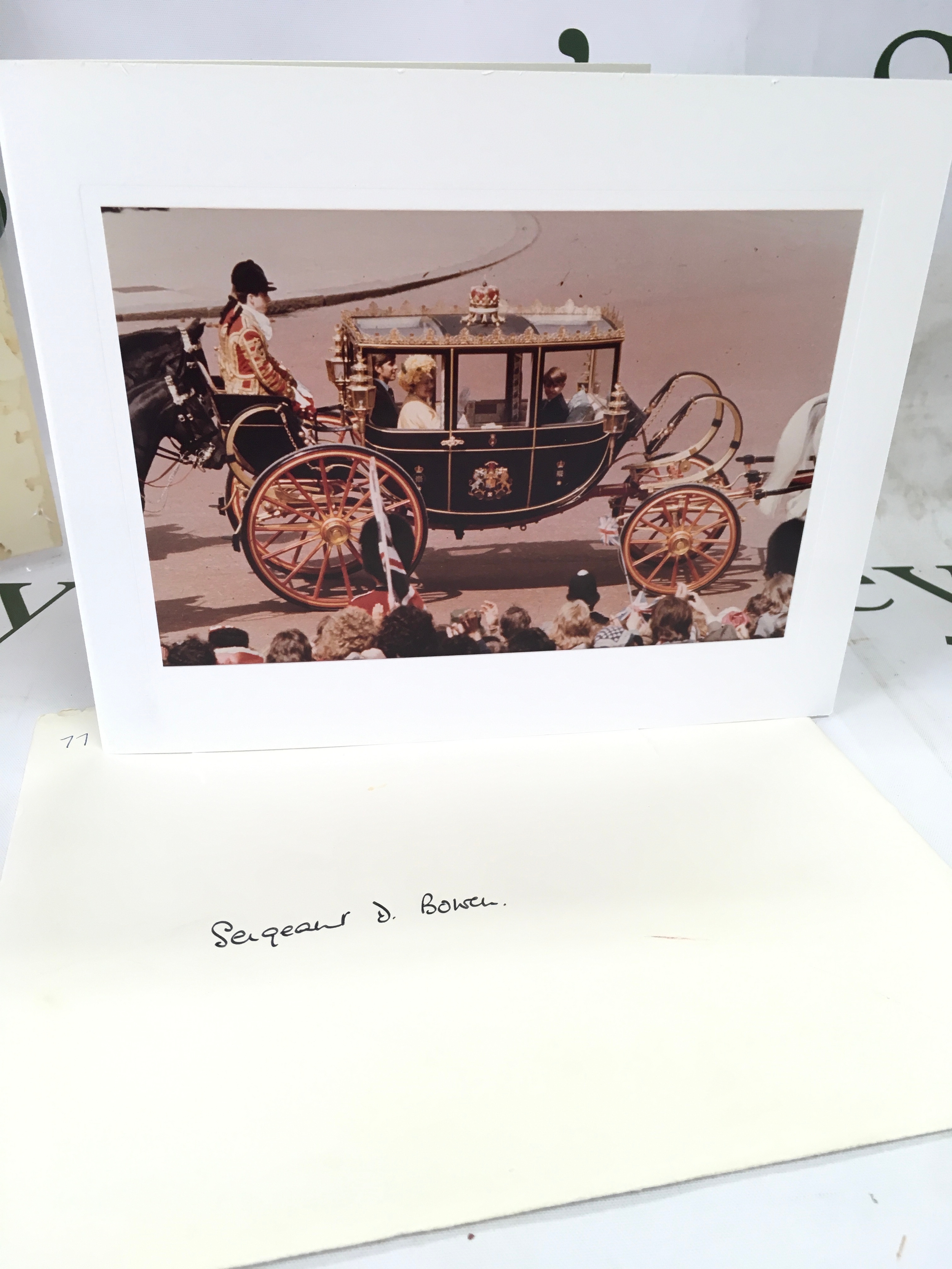 Signed Her Majesty Queen Elizabeth II Christmas card 1977, of Her Majesty riding in the Scottish State Carriage with TRHs Princes Andrew and Edward. Signed 'from Elizabeth R'.235mm x 186mm with envelope with smudge to cover [hand delivered at Clarence House]. Provenance: Sgt Daniel Owen Bowen RVM, Welsh Guards 1944-1968; member of Royal Household Clarence House 1968-1986, thence by descent.