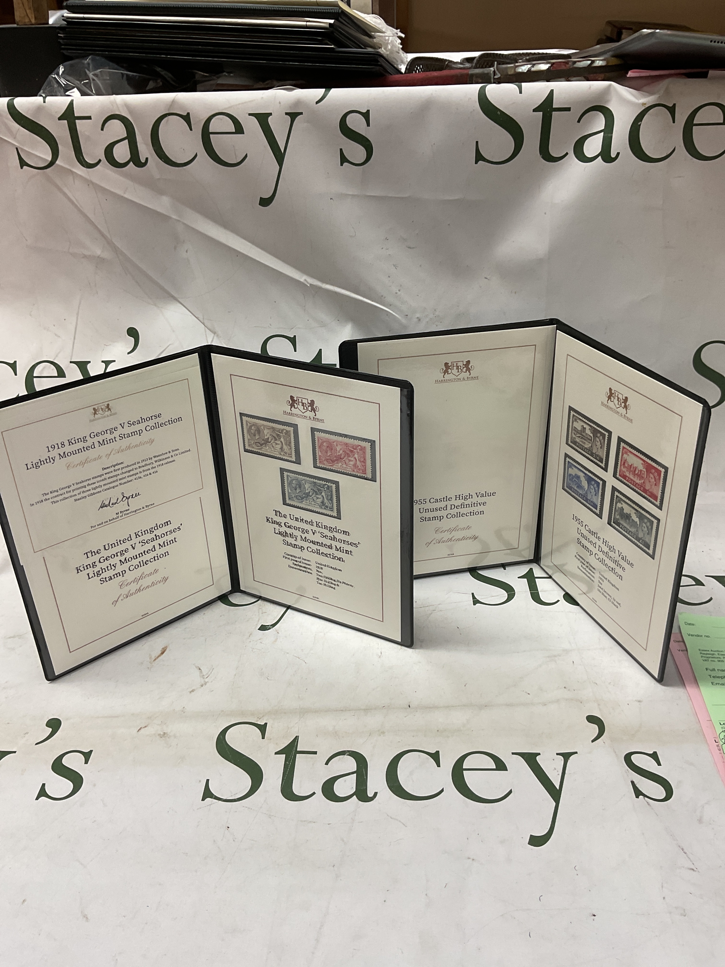 Harrington and Byrne folders of QEIIR Castles and GVR 1918 Sea Horses with certificates.