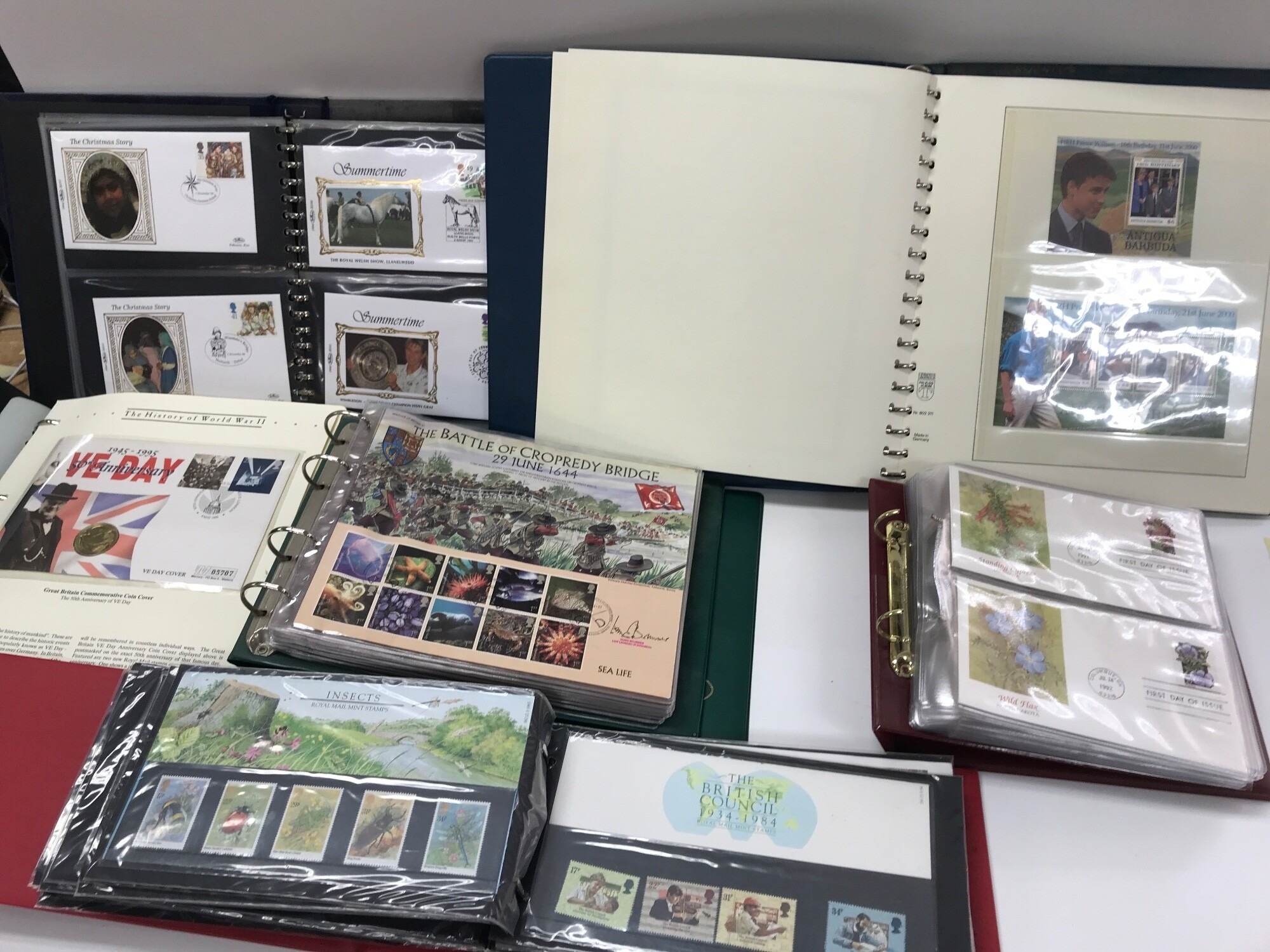 A large collection of assorted coin and stamp covers.