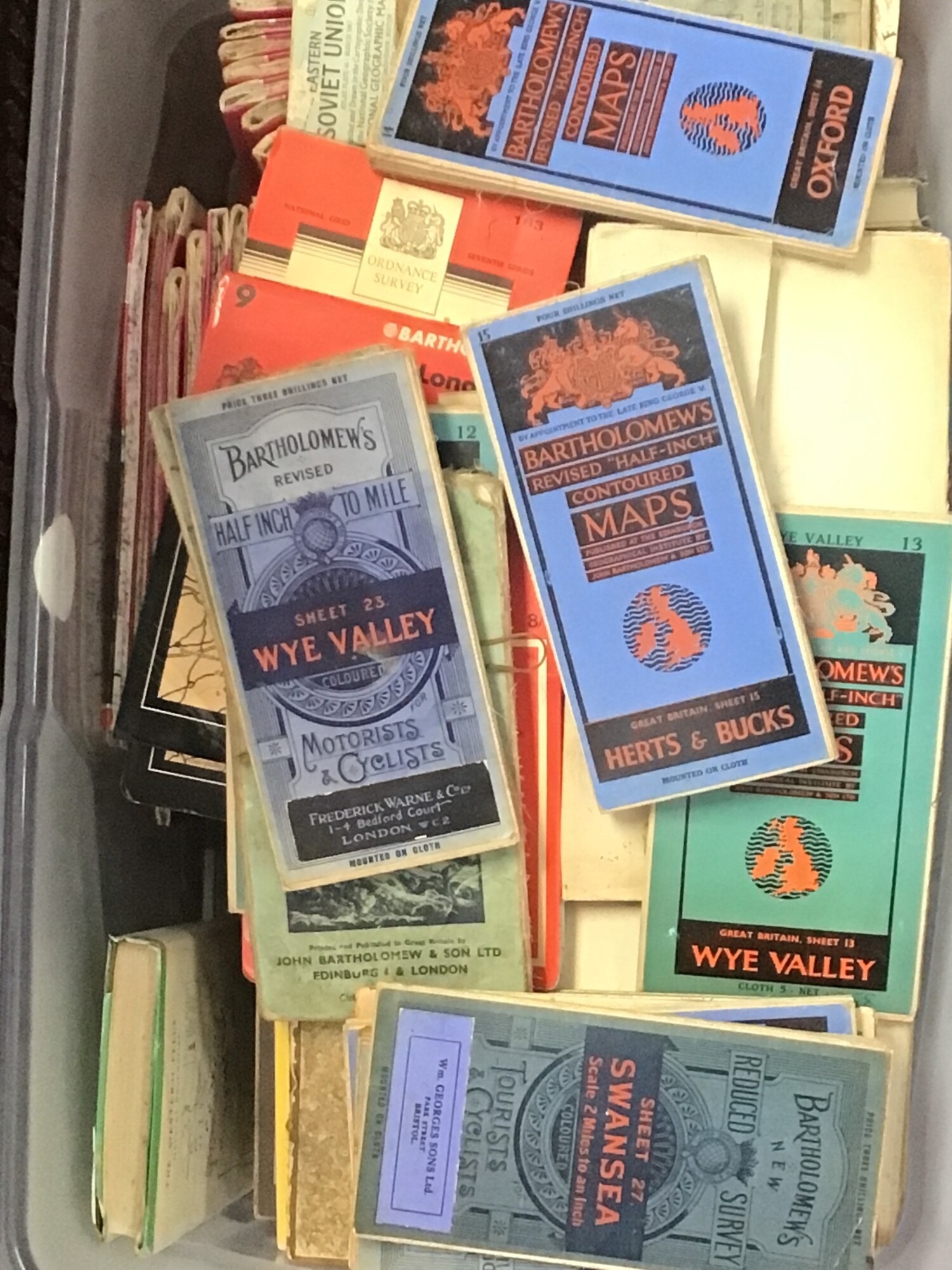 A box containing Bartholomews Vintage folding maps for Motorists and cyclists and other vintage road maps British maps. NO RESERVE