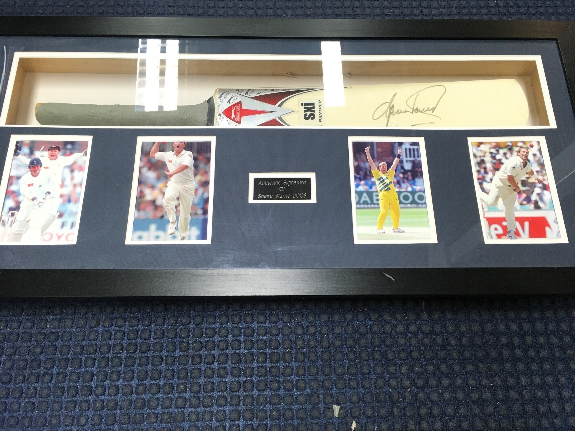 A Signed And Framed Cricket Bat By Shane Warne 2008. Approximate Size 92CM X 44CM