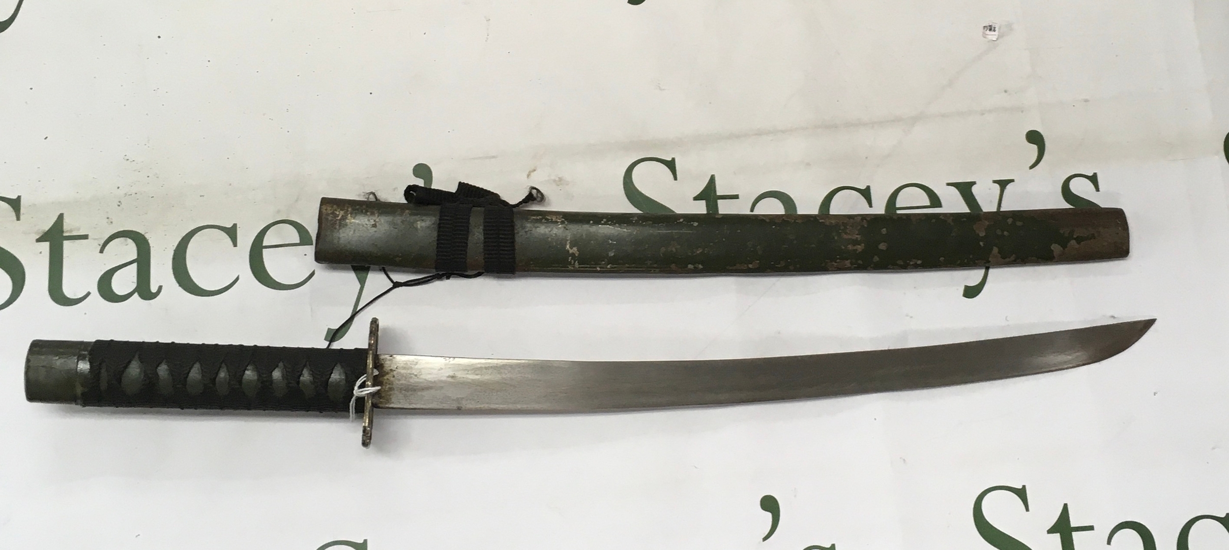 A Japanese wakizashi - a shorter traditional sword .