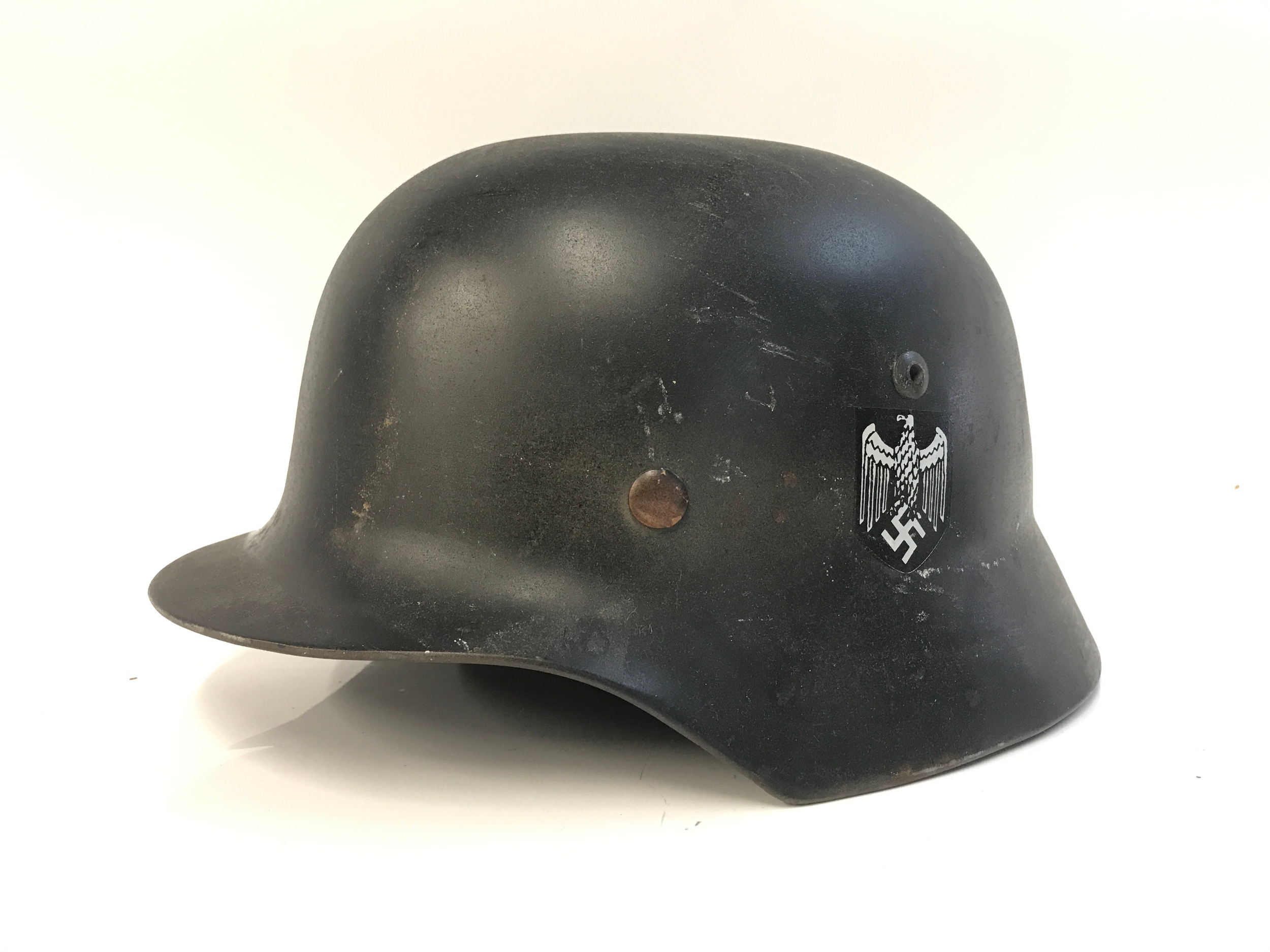 A German M35 Heer Helmet. 30cm long, 23cm wide 
