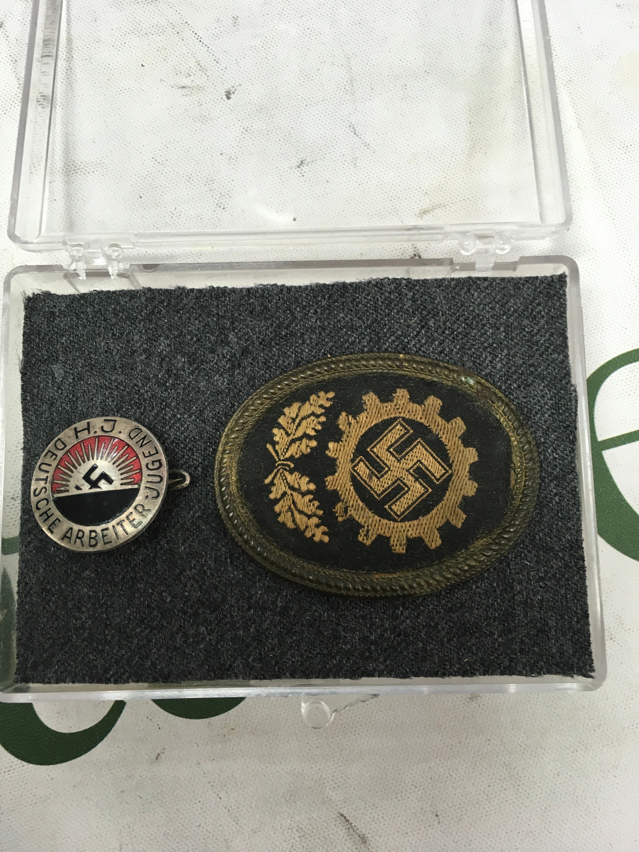 DAF cap badge and a Hitler youth badge . 