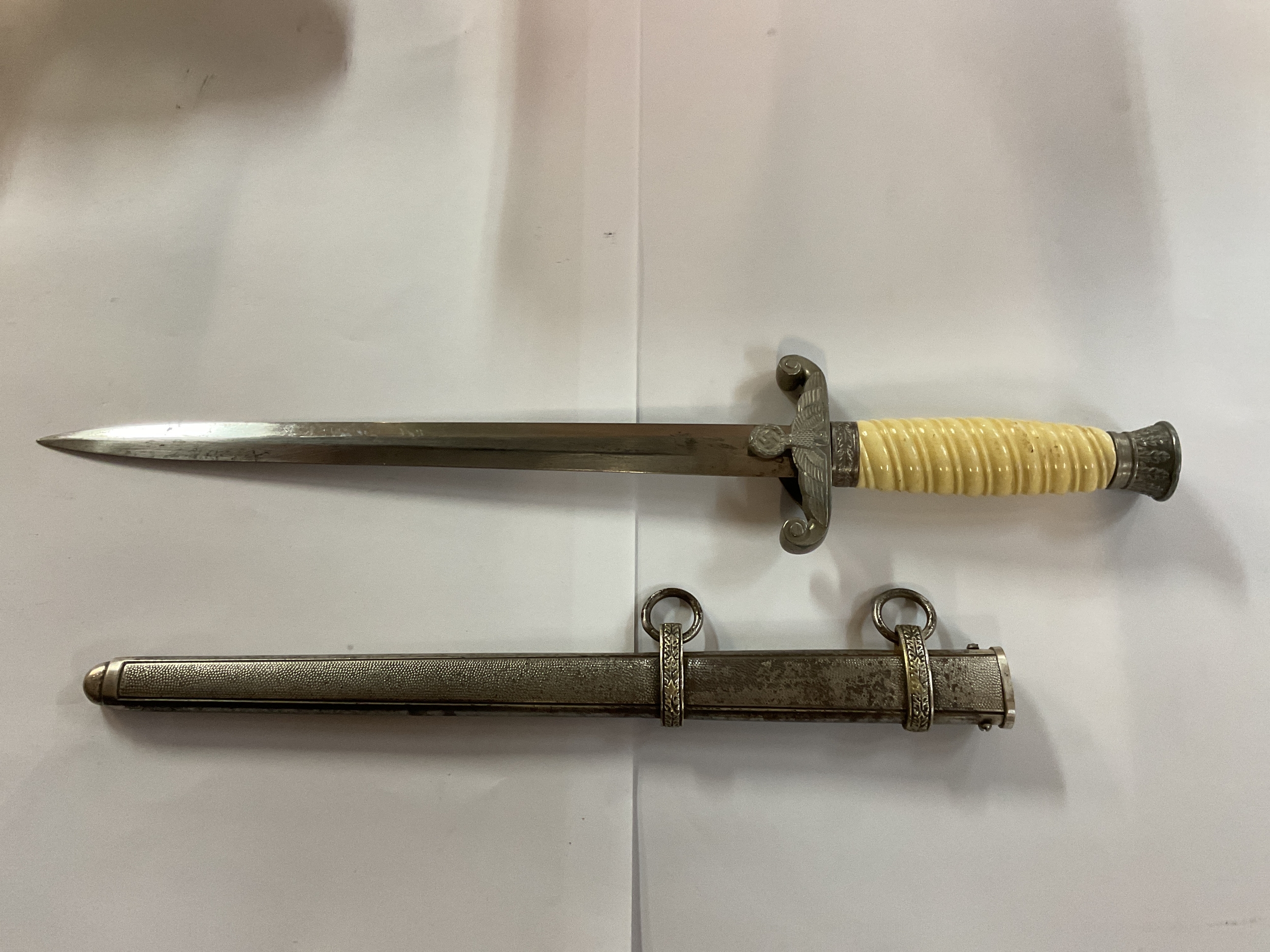 WWII German Army dress dagger with white grip.
